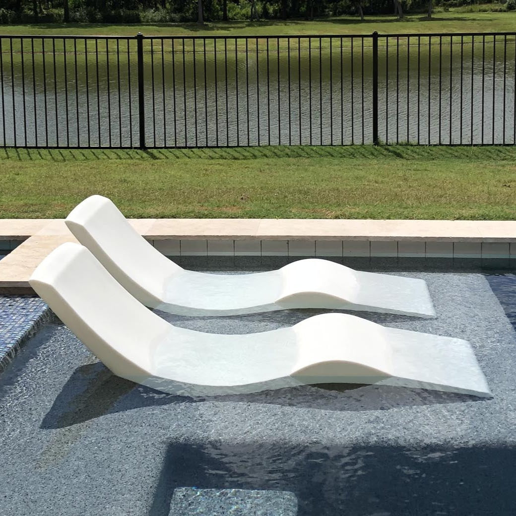Chaise lounge chairs by the pool