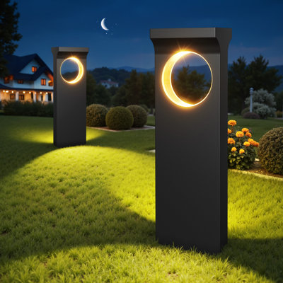 Garden walkway lit by warm solar path lights at dusk