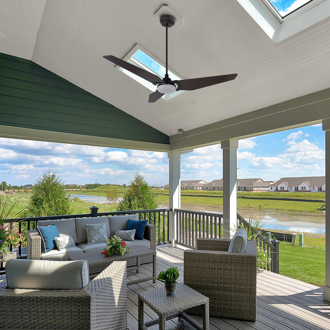 Outdoor ceiling fan with light kit on a screened porch